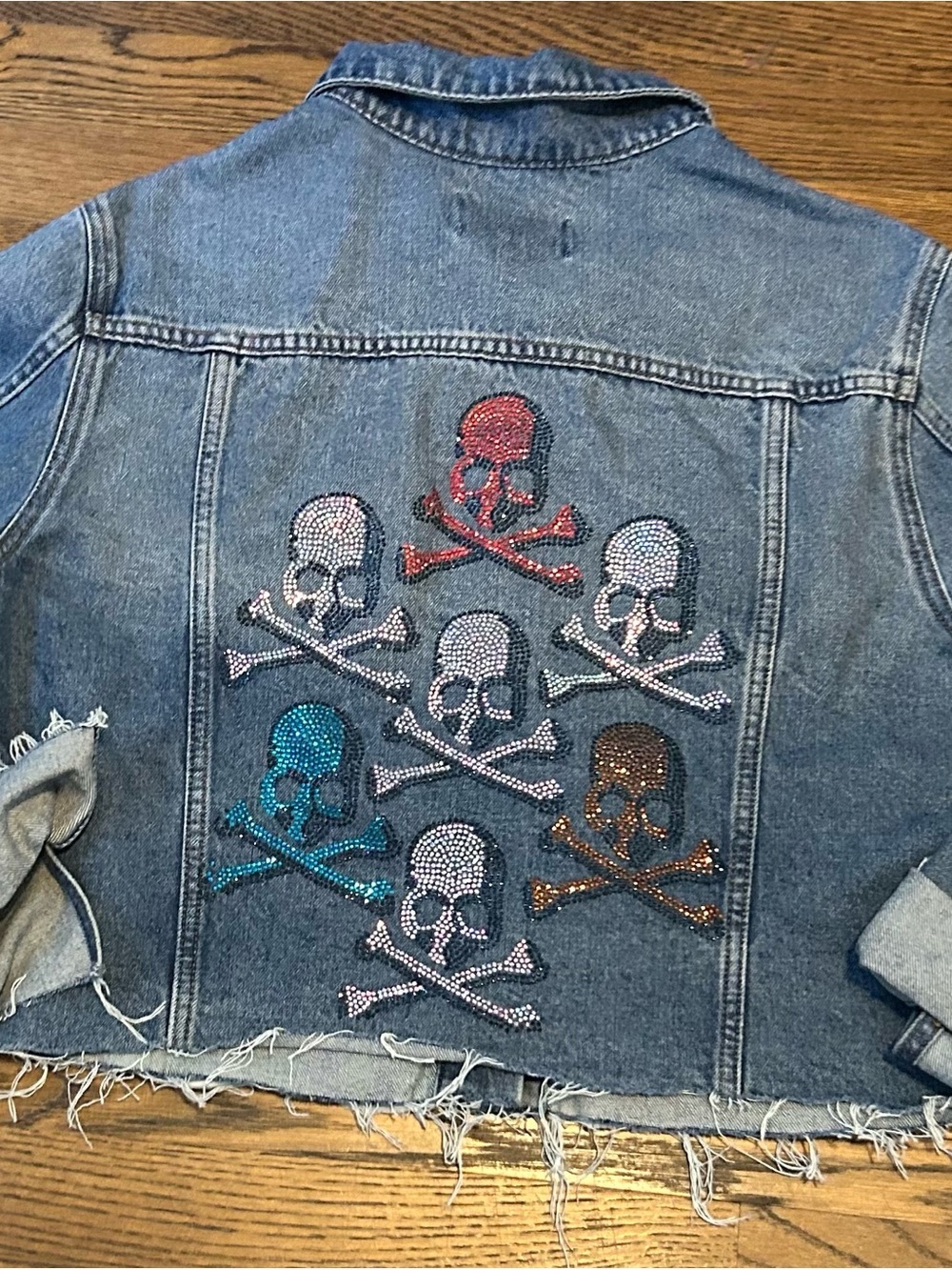 Embellished Denim Jacket with Multicolor Rhinestone Skull Motifs by xoxoE 0184